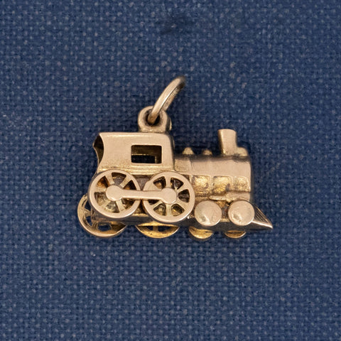 Vintage articulating train charm in 14kt yellow gold