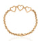 A vintage gold chain bracelet featuring three interlocking open heart charms at the top, displayed on a clean white background with a subtle reflection below.