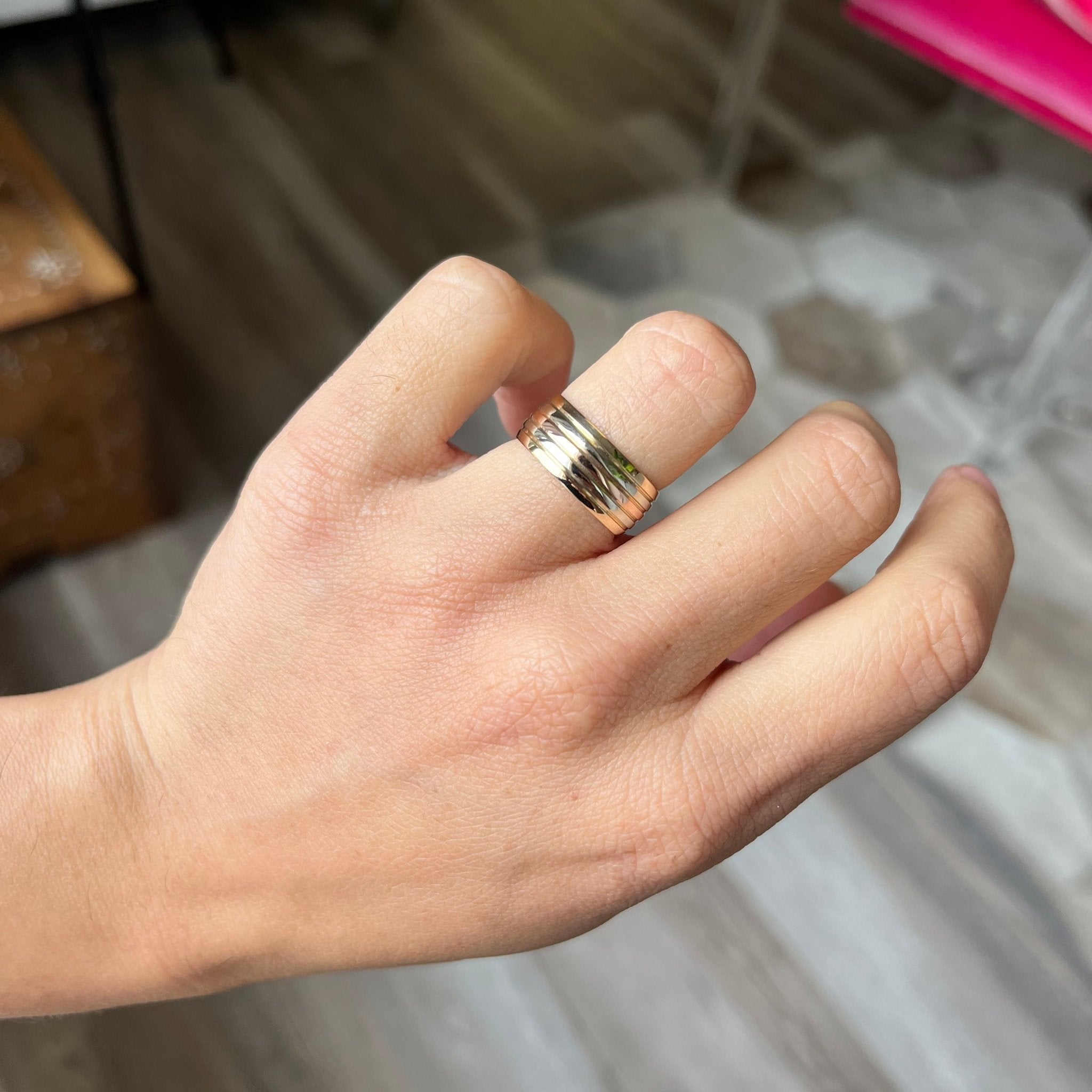 vintage triple tone 5 row 14kt gold wedding band on finger