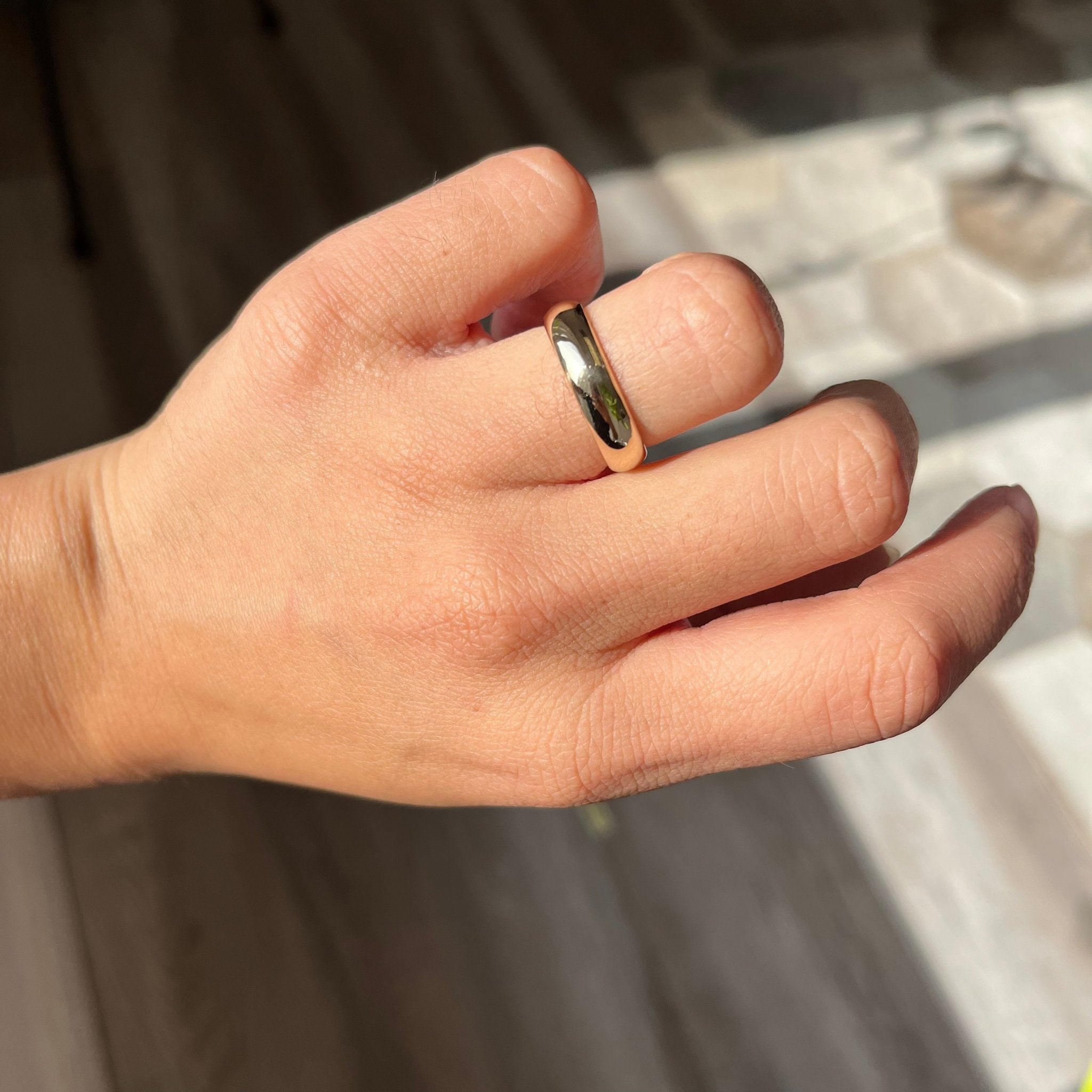 vintage gold band on finger