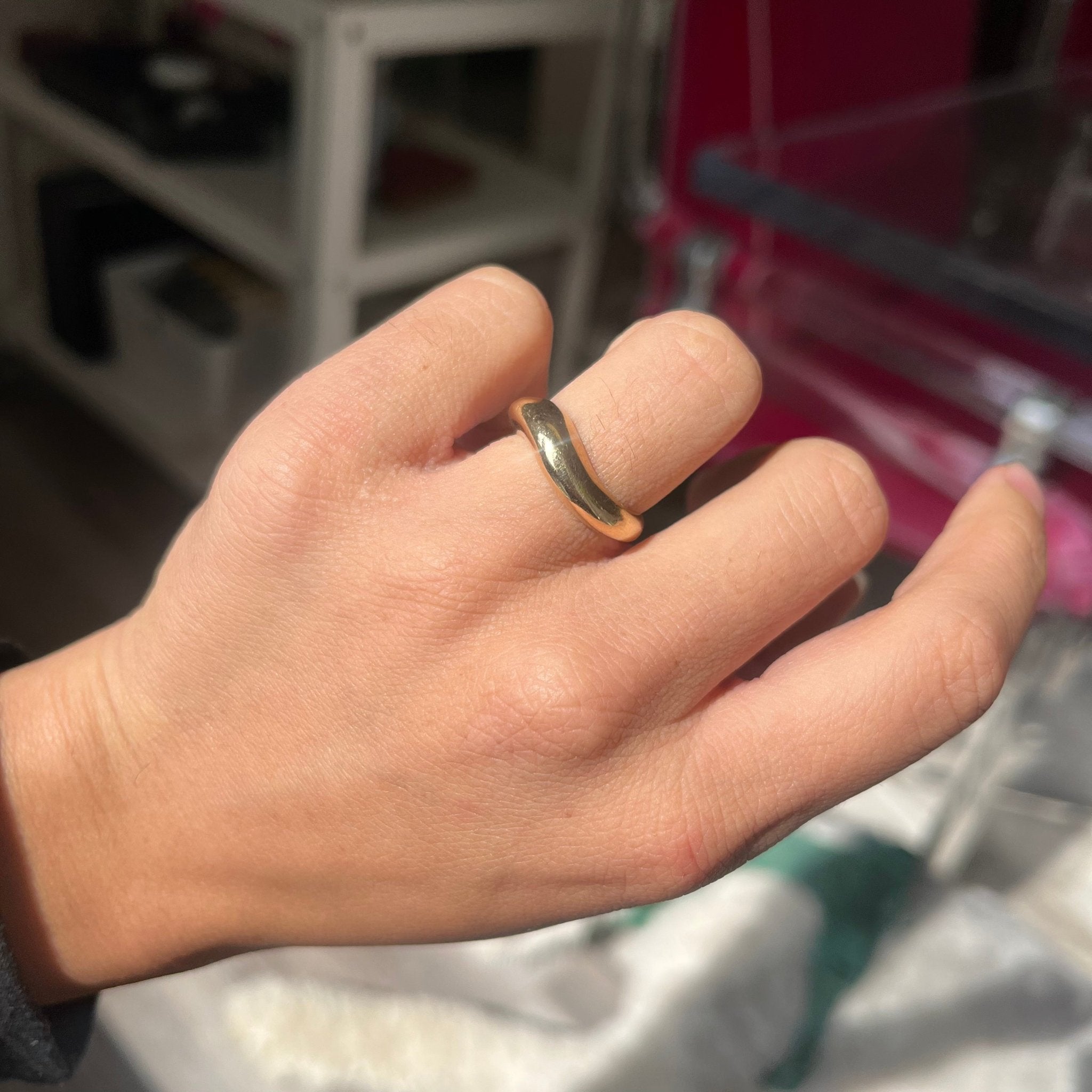 vintage gold wedding band on finger