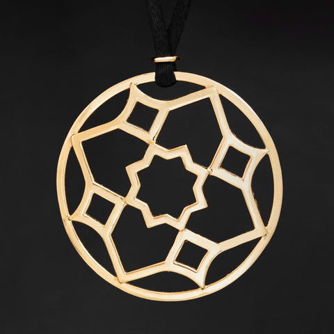 Vintage Paloma Picasso for Tiffany & Co. Zellige medallion pendant on black cord in 18kt yellow gold