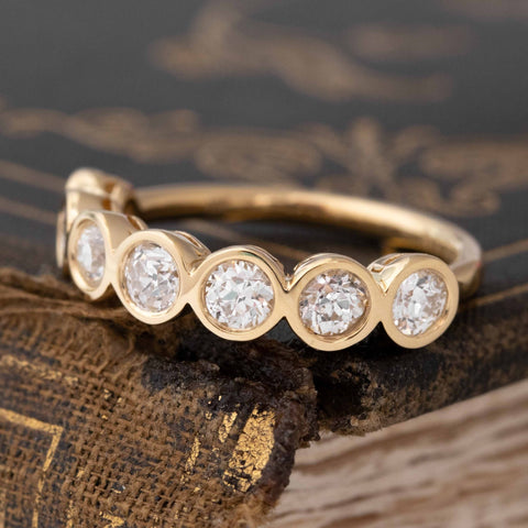 Antique lovers’ .90ctw Old European Cut Diamond Bezel 7-Stone Band in yellow gold, featuring rare Earth-mined Old European Cut Diamonds