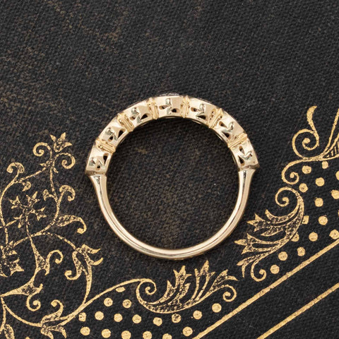 Side view of .90ctw Old European Cut Diamond Bezel 7-Stone Band, vintage-inspired band with Old European Cut Diamonds, crafted in yellow gold