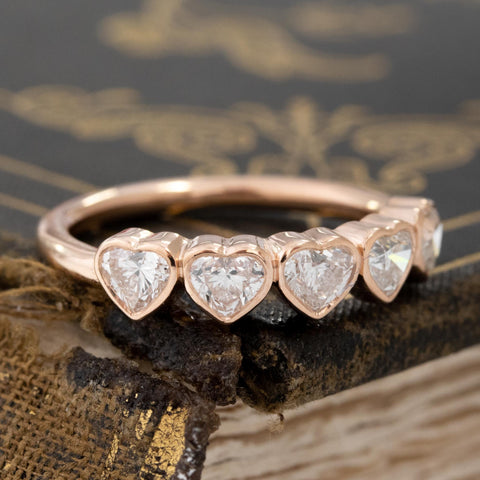 Close-up of .92ctw Heart Cut Diamond 5-Stone Bezel Band, vintage-inspired band with Antique Diamonds, crafted in rose gold