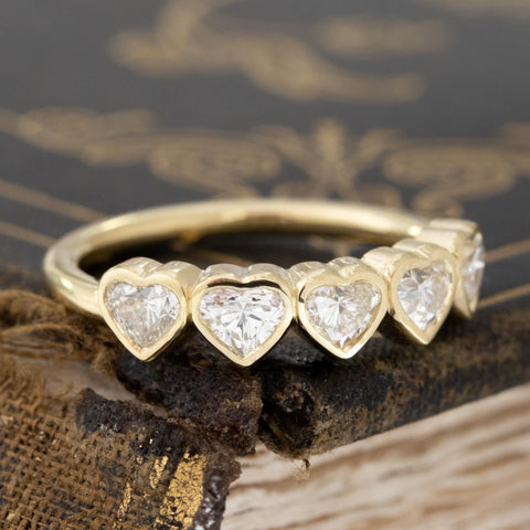 Close-up of .93ctw Heart Cut Diamond 5-Stone Bezel Band, vintage-inspired band with Antique Diamonds, crafted in yellow gold