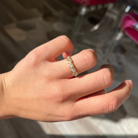 Elegant .93ctw Heart Cut Diamond 5-Stone Bezel Band, romantic design with Antique Diamonds, Earth-mined diamonds in yellow gold shown on ring finger