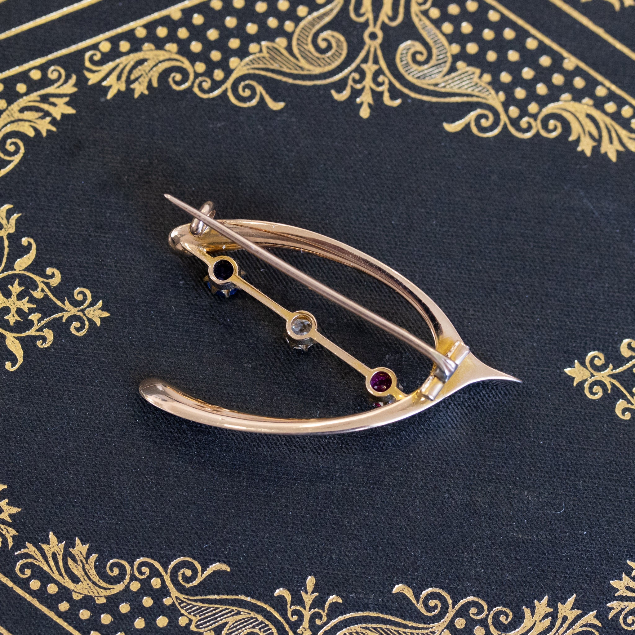 Victorian Diamond, Ruby, and Sapphire Wishbone Brooch